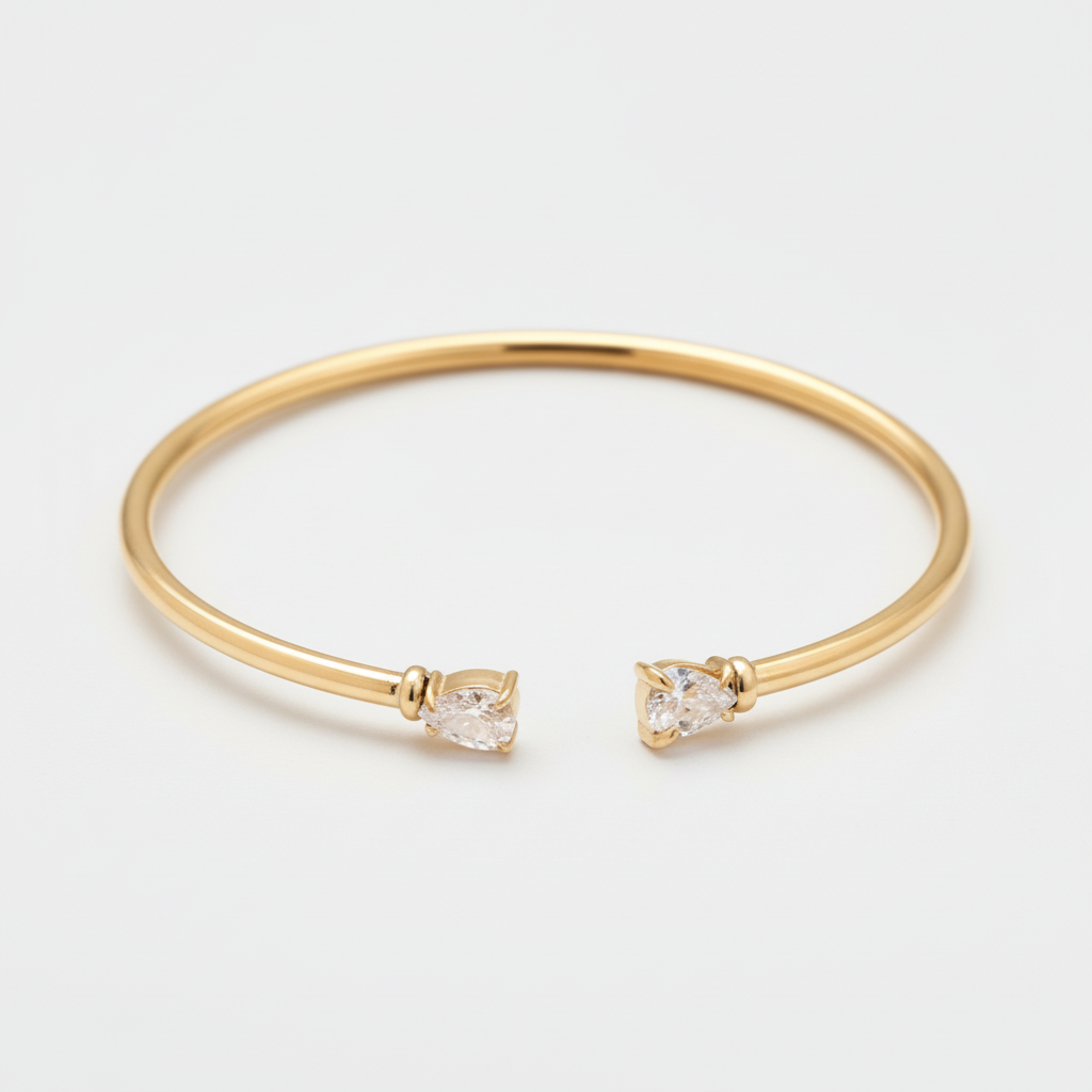 Bracciale rigido dorato con cristalli