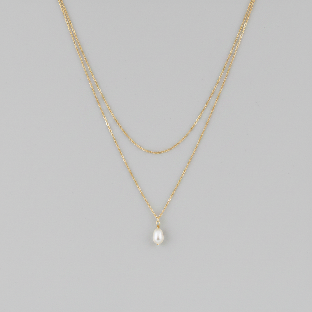 Collana doppia gold perla - sfondo grigio chiaro piatto