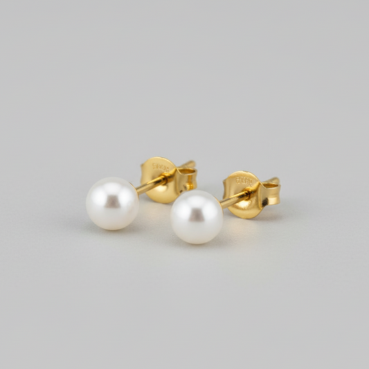 Orecchini perla sfondo grigio compatto