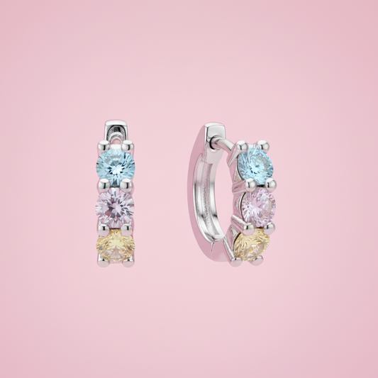 Orecchini sfondo rosa pastello uniforme